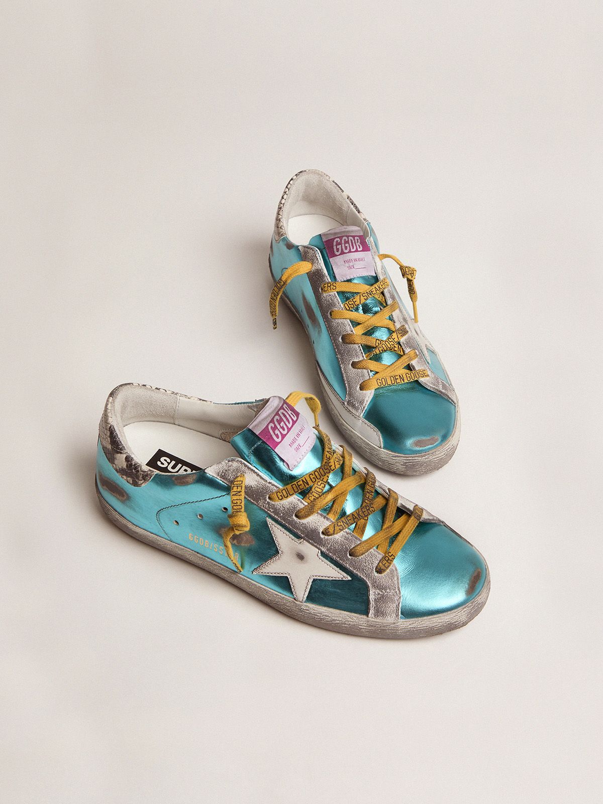 Turquoise green laminated Sup-S LTD sneakers with snake-print heel tab