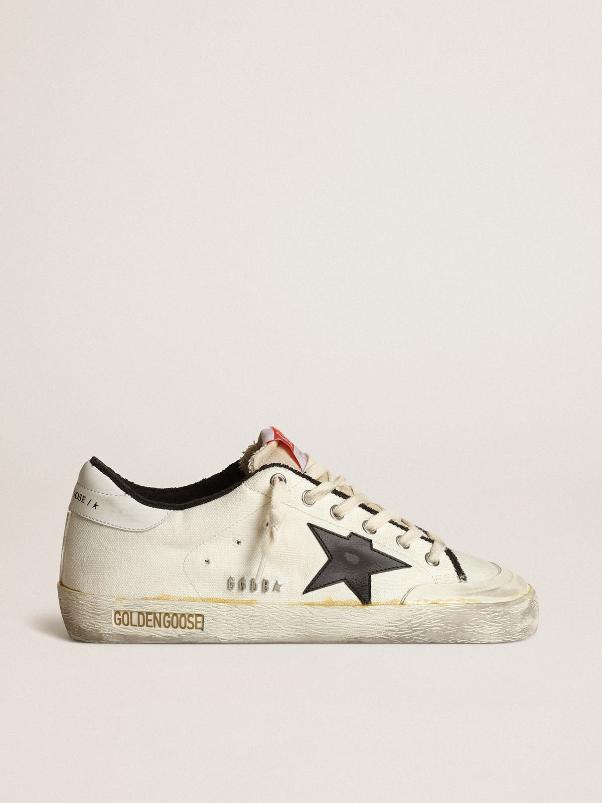 Women's Sup-S LTD sneakers in beige canvas with black leather star and white leather heel tab
