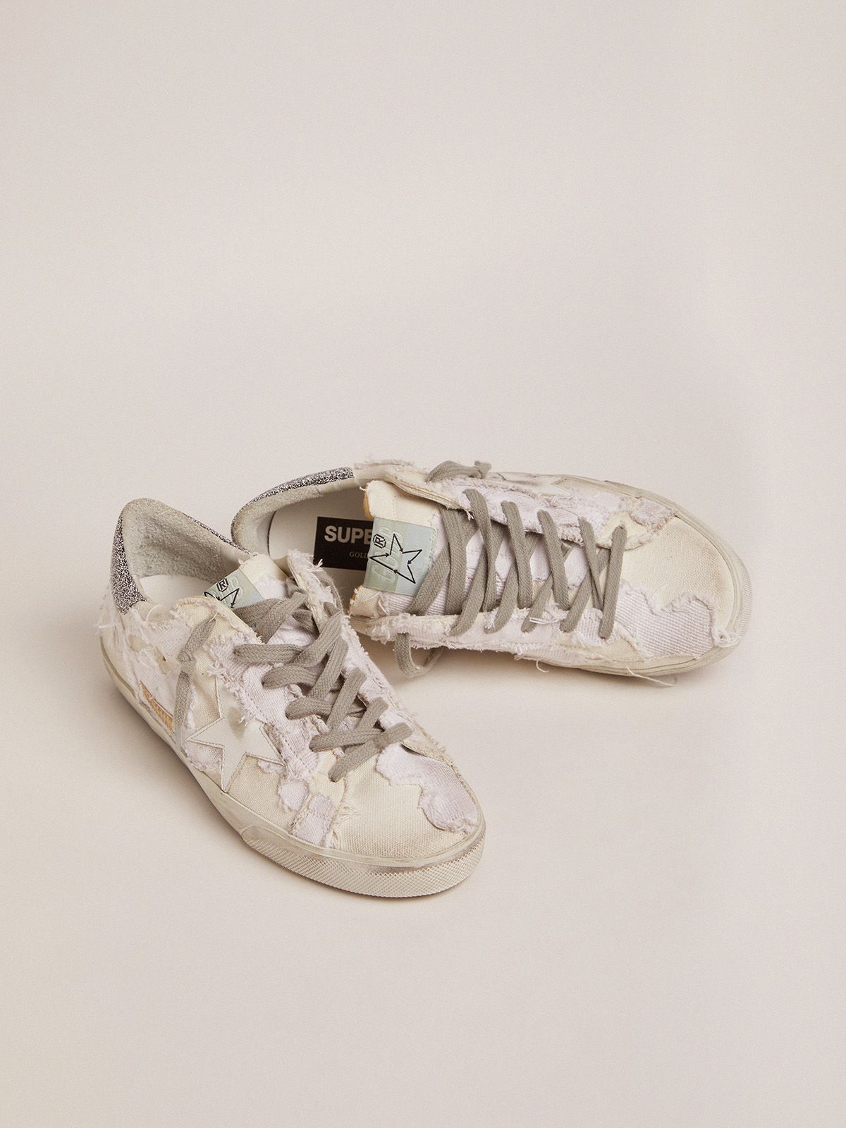 Sup-S sneakers in white canvas with black Swarovski crystal heel tab
