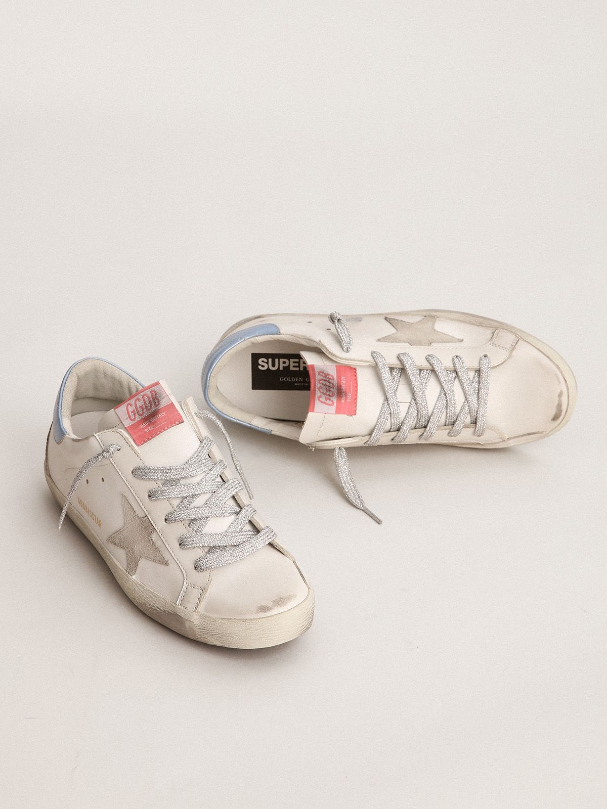 Sup-S sneakers with sky-blue laminated leather heel tab and ice-gray suede star