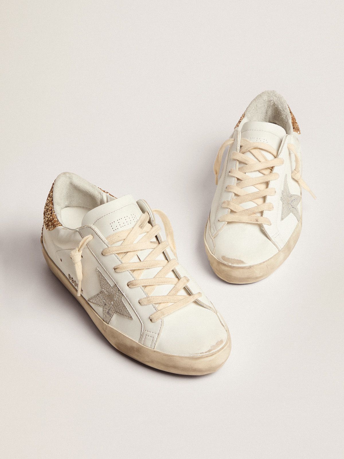 Sup-S sneakers with snake-print silver leather star and gold glitter heel tab