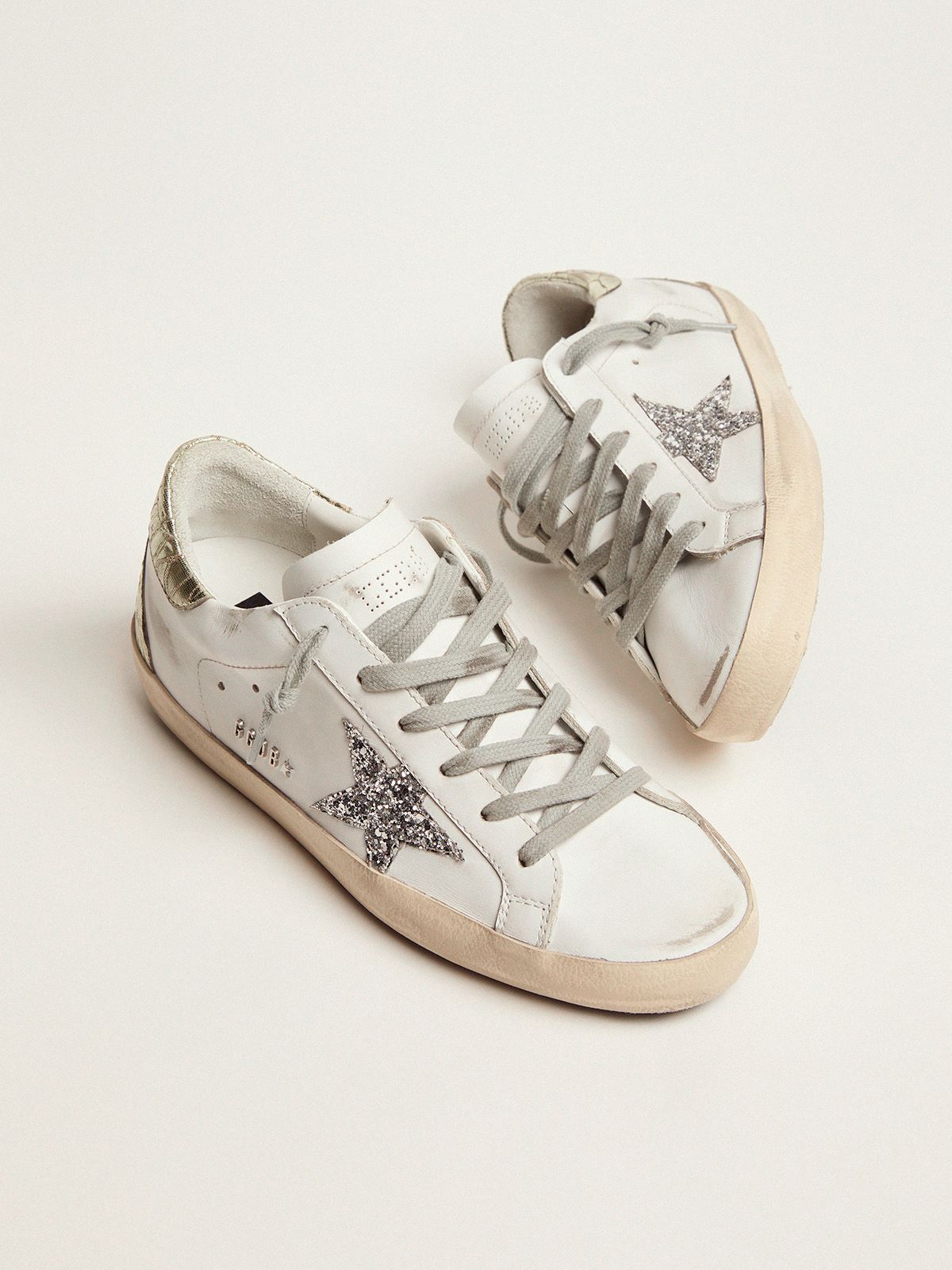 Sup-S sneakers with silver glitter star and glossy gold leather heel tab