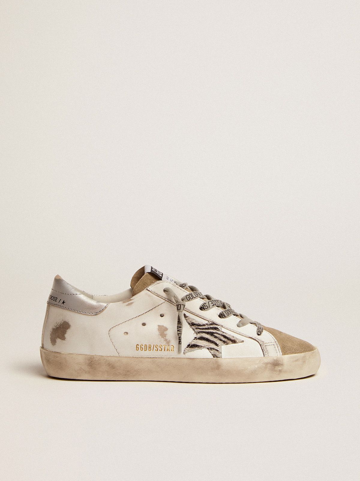 Sup-S sneakers with silver laminated leather heel tab and zebra-print pony skin star