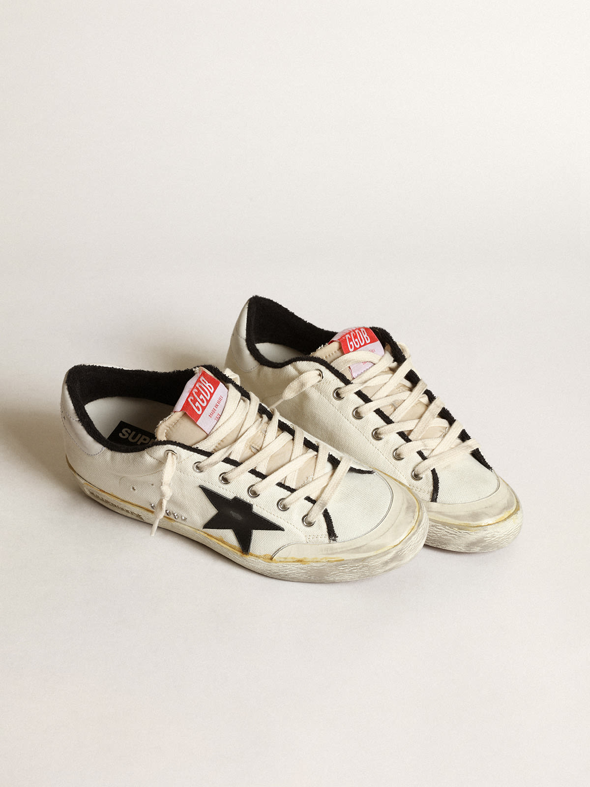 Women's Sup-S LTD sneakers in beige canvas with black leather star and white leather heel tab