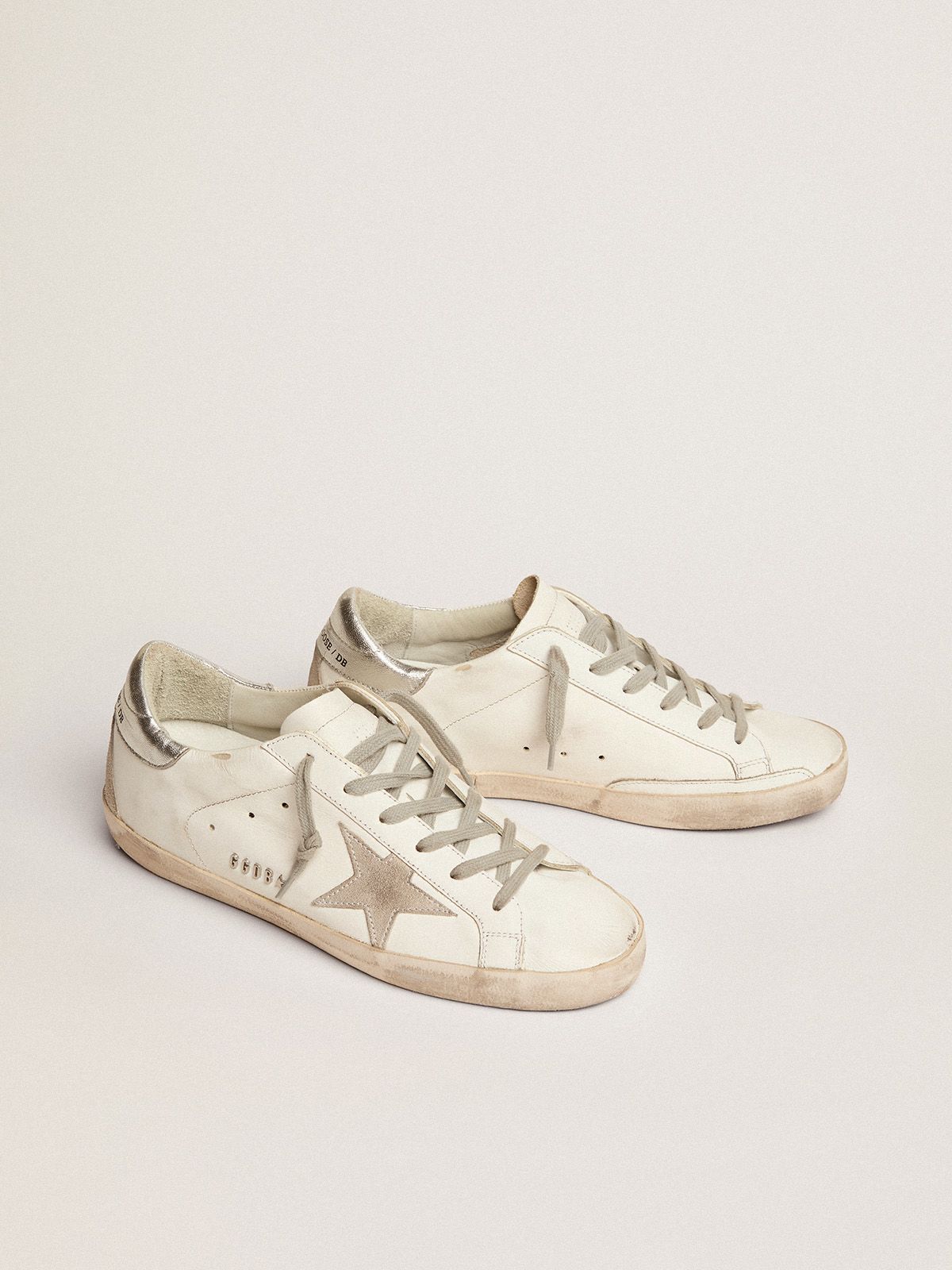 Sup-S sneakers with silver-coloured heel tab and metal stud lettering