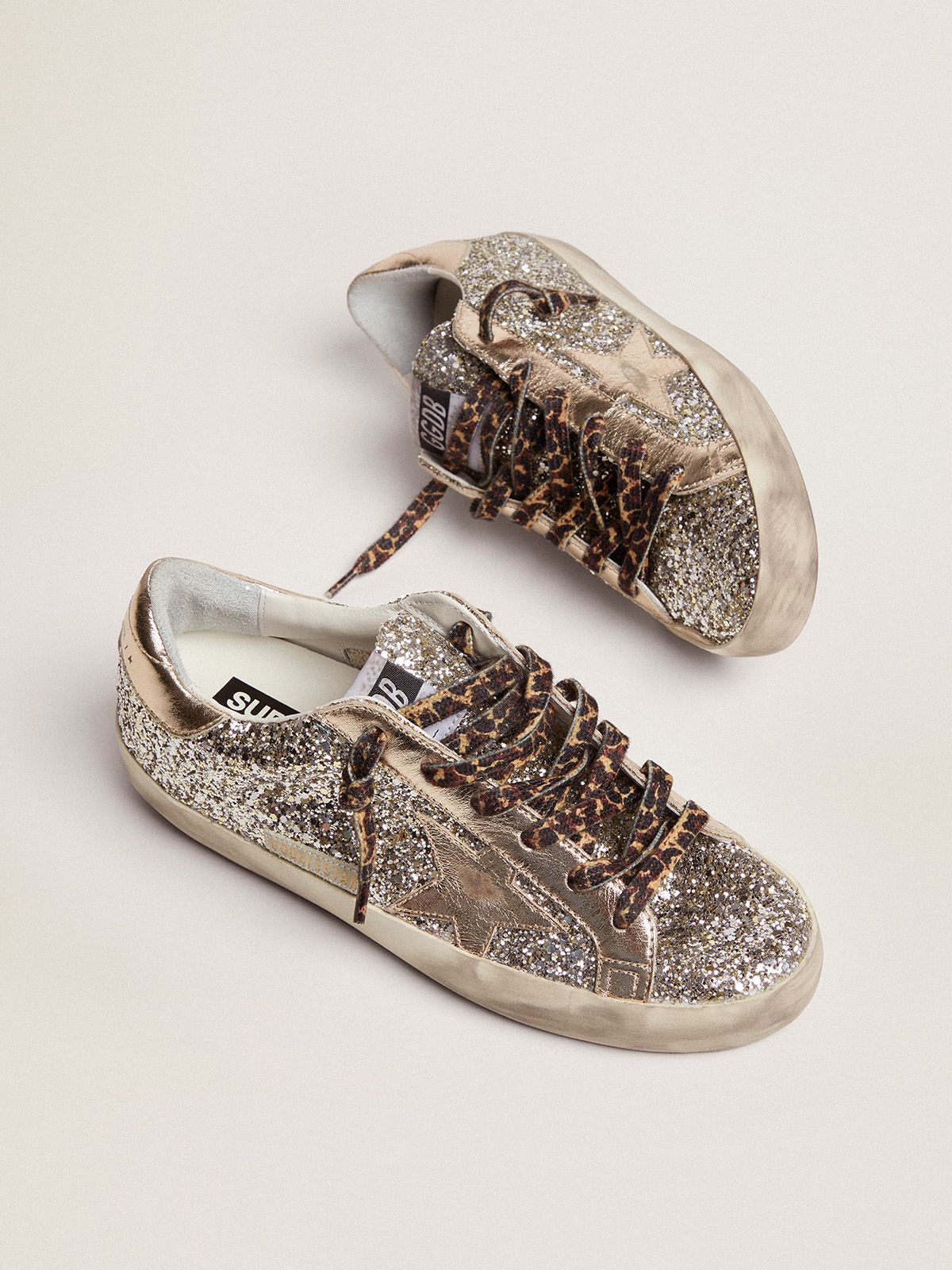 Sup-S sneakers in platinum-colored glitter with star and heel tab in tone-on-tone laminated leather